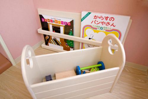 a toy house with toys inside of it at Hotel Epinard Nasu in Nasu