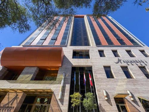 a tall building with a sign on it at Hotel Alejandro I, Affiliated by Meliá in Salta