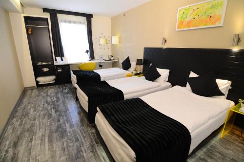 Katil atau katil-katil dalam bilik di Tempo Hotel Caglayan