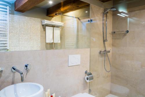 a bathroom with a shower and a sink at Armada Apart Ustka in Ustka