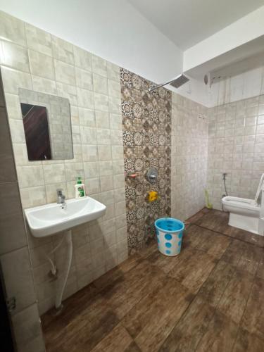 a bathroom with a sink and a toilet at Haven Stay in Panchanai