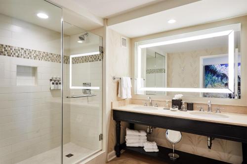 a bathroom with a sink and a shower at Wild Dunes Resort - Sweetgrass Inn and Boardwalk Inn in Isle of Palms