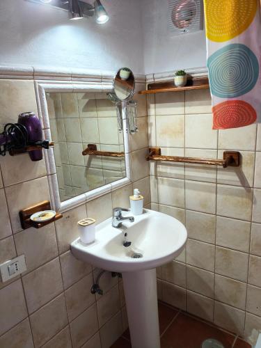 a bathroom with a sink and a mirror at Casita Bentayga in Tejeda