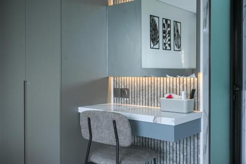 a desk in a room with a chair at Root and Rise Cabins in Tabanan