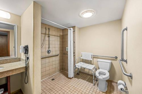 a bathroom with a toilet and a walk in shower at Comfort Suites Near Gettysburg Battlefield Visitor Center in Gettysburg