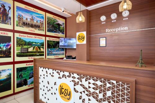 a lobby of a hotel with posters on the wall at Itsy Hotels NRM Residency - Near Mysore Palace in Mysore