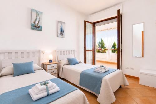 a bedroom with two beds and a window at Quiet Home in Pula