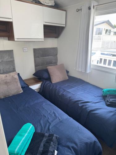 a room with two beds and a window at Nancy staycation in Clacton-on-Sea