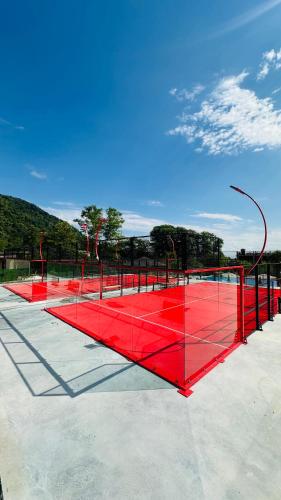 a red tennis net on a tennis court at Wald Hotel N1 Building in Lagodekhi