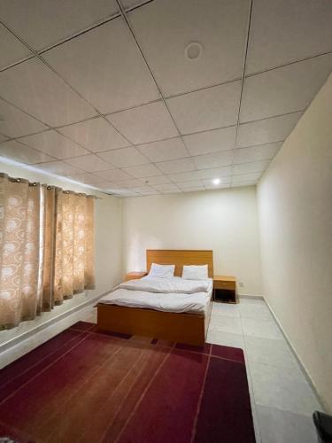 a bedroom with a bed in a room at Lee Rivage Inn in Naran
