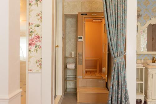 a closet with an orange cabinet in a room at WhiteRunse in Takayama