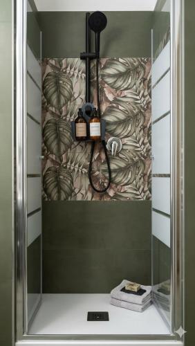 a shower in a bathroom with a wall at Penthouse a Silvi Marina in San Silvestro