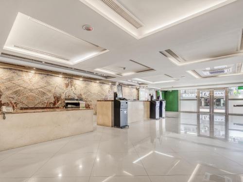 a large room with a counter in a building at Guide Hotel Taipei Bade in Taipei