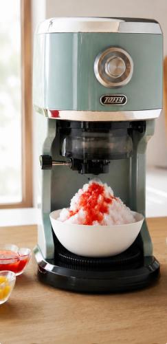 a food processor with a bowl of food in it at Banksia Seaside Cottage in Ōami