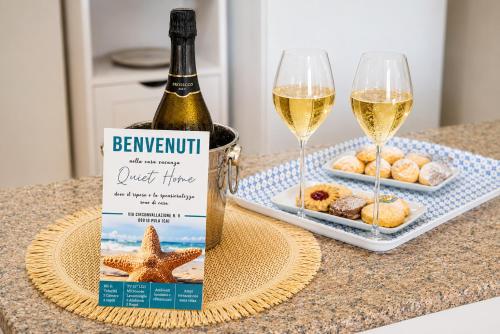 a bottle of champagne and two glasses of wine at Quiet Home in Pula