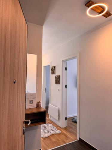 a room with a hallway with a door and a mirror at Bjelašnica Slope View in Bjelašnica