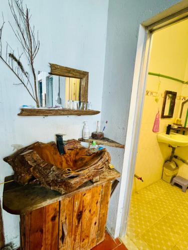 a bathroom with a wooden sink and a mirror at Một Homestay Mang Den in Kon Von Kla
