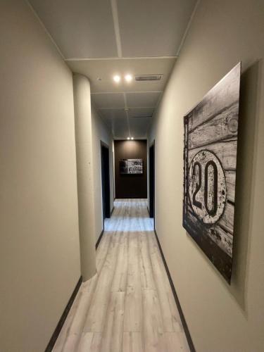 a long hallway with a number on the wall at Hotel Centro Braseros in Burgos