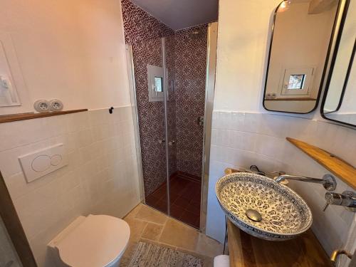 a bathroom with a sink and a shower at Casa Limone - a due passi dal lago in Castelletto di Brenzone