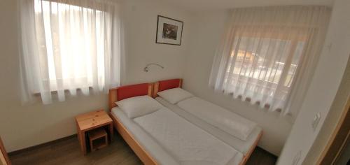 מיטה או מיטות בחדר ב-Pitterlehof