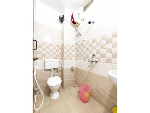 a bathroom with a toilet and a sink at The Annapurna Resort Hotel & Restaurant - Walking From 100m From Sea Beach, Free Wifi, Parking Available ! Luxury & Best Hotel in Puri in Puri