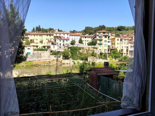 a view of a city from a window at Albizi Home in Pontassieve