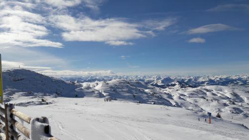 a group of people skiing down a snow covered mountain at Familie Seiwald in Waidring