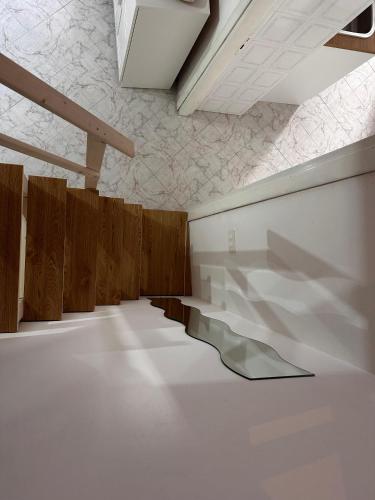 a room with a white floor and wooden walls at Tenuta Moffa in Tramonti
