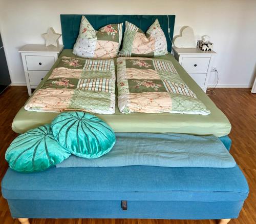 a bed with two mattresses and pillows on it at Haus Güldengossa in Großpösna