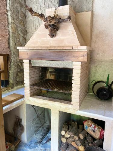 a model of an outdoor oven in a toy house at Legendarium Casa Rural in Salamón