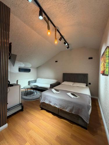 a bedroom with a bed and a table in it at KRAL GRAND OTEl in Istanbul