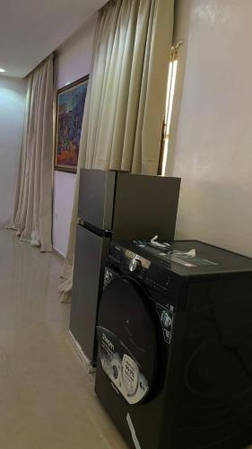 a room with a computer monitor and a speaker at Cyril O Apartment in Lagos