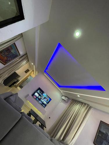 an overhead view of a living room with a laptop on the ceiling at Cyril O Apartment in Lagos