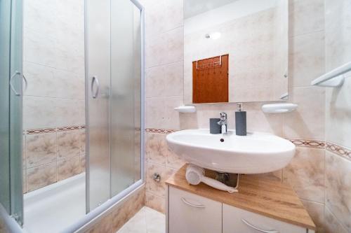 a bathroom with a sink and a shower at Marin in Lopar