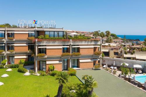 an aerial view of a resort with a swimming pool at Four Points by Sheraton Catania Hotel in Catania