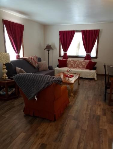 a living room with a couch and a table at Simple Stay in Youngstown