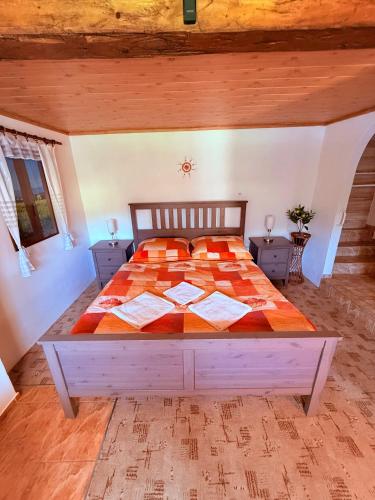 a bedroom with a large bed in a room at u Vlastika in Jeseník