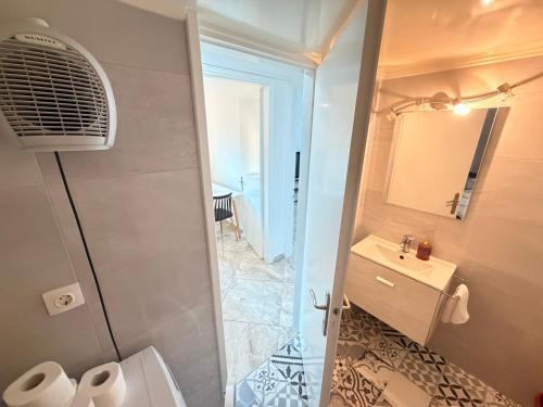 a bathroom with a shower and a toilet and a sink at Central Park Chíos in Chios