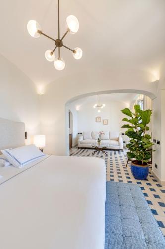 a bedroom with a bed and a large mirror at San Montano Resort & Spa in Lacco Ameno