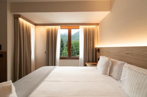 Llit o llits en una habitació de Hotel Bruna