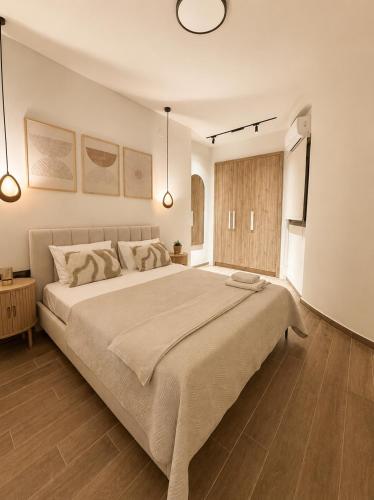 a bedroom with a large bed in a room at Noema City View in Xanthi