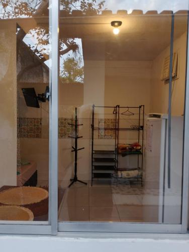 a window of a store with a view of a room at Vereda da Lagoa in Niterói