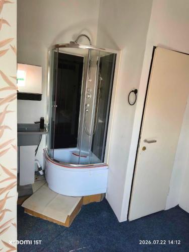 a bathroom with a shower and a sink at Centrum Panzió VIP in Kaposvár