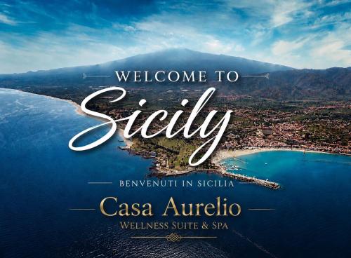 a welcome to stay poster with a view of the ocean at Casa Aurelio Wellness Suite & Spa Inclusive in Taormina