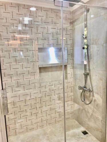 a shower with a glass door in a bathroom at Villa Ada Bohème in Muğla