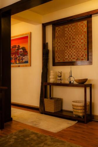 a room with a shelf and a picture on the wall at Gakyi Homes Boudha in Kathmandu