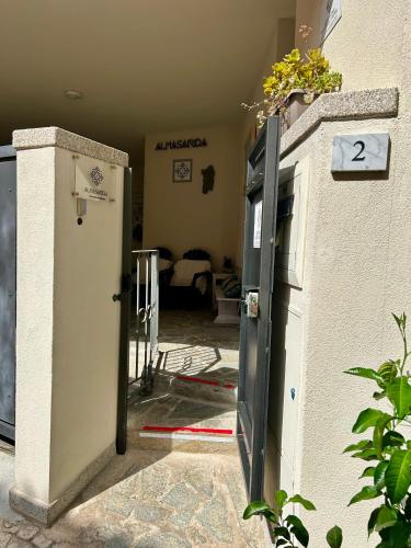 an open door to a room with a house at Almasarda in Olbia