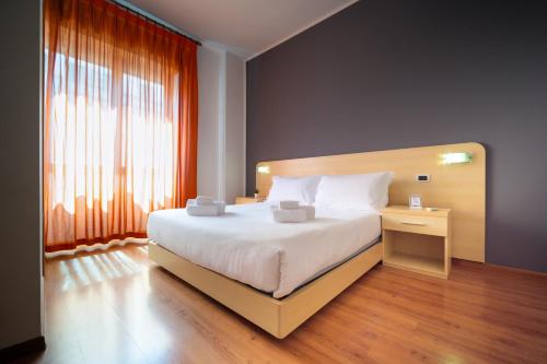 Llit o llits en una habitació de GRIF Hotel