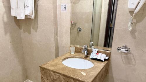 Vonios kambarys apgyvendinimo įstaigoje Seven Gardens Hotel