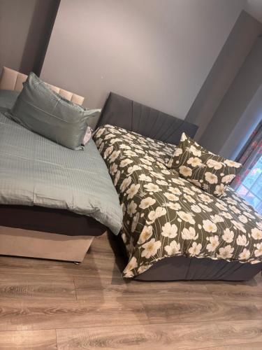 a bed with a comforter and pillows in a room at Viking Triangle in Waterford